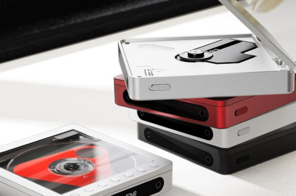 FIIO DM13 wysoka moc wyjściowa 660 mW odtwarzanie słuchawek, odwarzacze CD w różnych kolorach leżące na stole