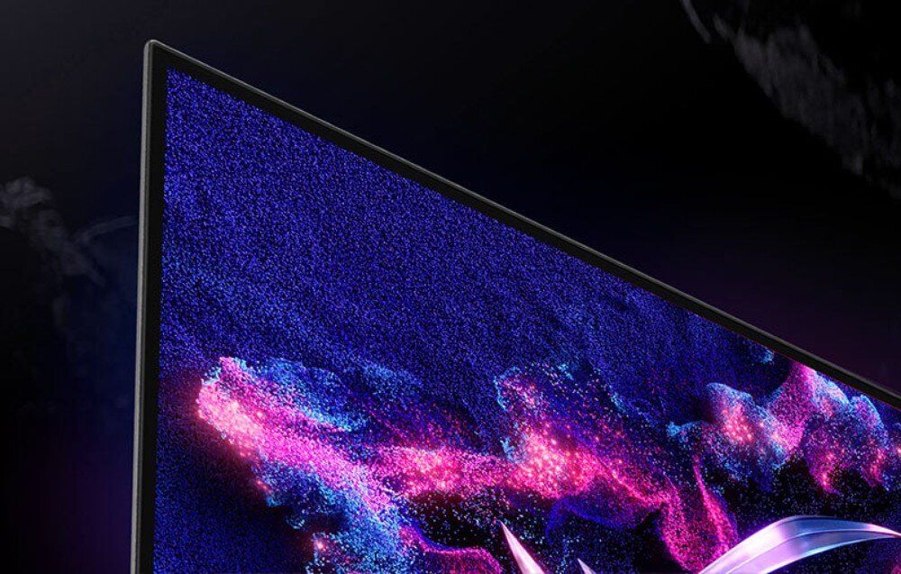 Monitor ASUS ROG Strix XG27ACDNG Zbliżenie na górny róg ekranu monitora, prezentujące szczegółowość wyświetlanych pikseli i bardzo cienką ramkę, redukcja migotania, ASUS Dynamic Shadow Boost, funkcje