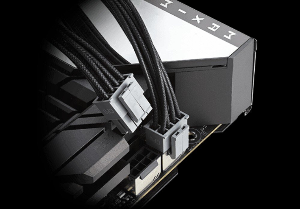 Zasilacz ASUS ROG Strix 1000W Zbliżenie na dwa szare złącza zasilające z czarnymi kablami w oplocie podłączone do gniazd na płycie głównej