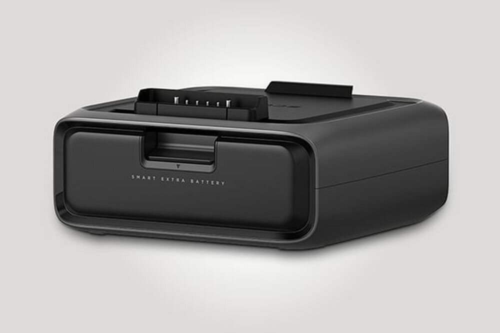 Czarna bateria o prostokątnym kształcie z napisem \'SMART EXTRA BATTERY\' na przedniej części. Na górze widoczne są złącza do podłączenia urządzenia.