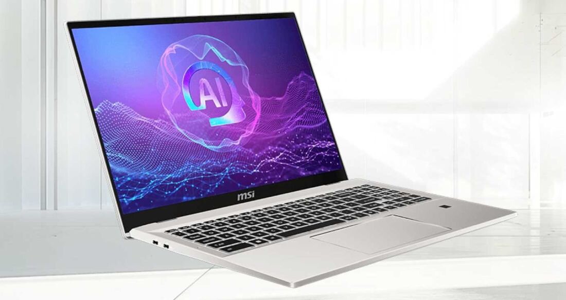 Laptop MSI Prestige A16 AI+ w kolorze srebrnym na jasnym tle, otwarty, wyświetlający na ekranie kolorową grafikę AI, cienkie ramki, pełnowymiarowa klawiatura i duży touchpad.- AMD Ryzen, RAM LPDDR5x, dysk SSD, długi czas pracy na baterii  