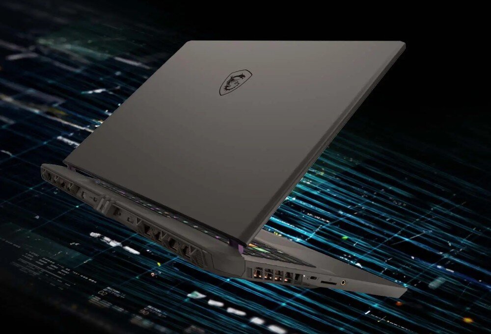 Laptop gamingowy MSI Vector 17 na ciemnym tle, z eleganckim designem i podświetleniem klawiatury. pamięć dysk pojemność szybkość