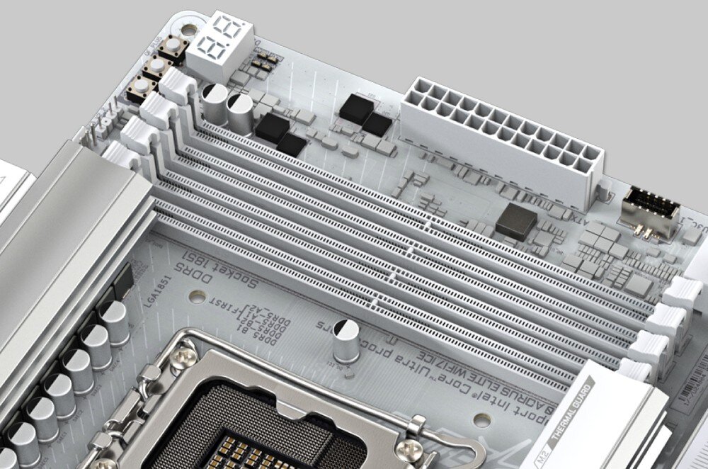 Płyta główna GIGABYTE B860 Aorus Elite WiFi 7 Ice Zbliżenie na górną część białej płyty głównej pokazujące cztery sloty na pamięć RAM oraz gniazdo procesora z oznaczeniem 'LGA1851'