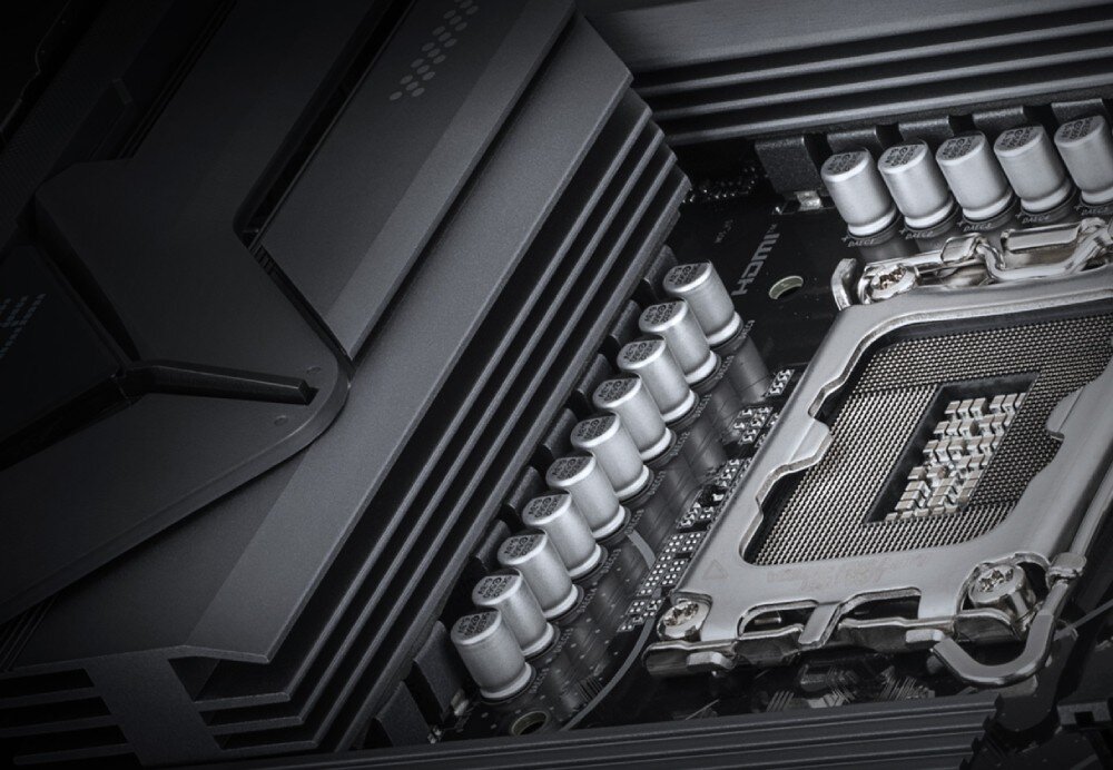 Płyta główna GIGABYTE B860 Eagle WiFi6E Zbliżenie na radiatory chłodzące i kondensatory znajdujące się wokół gniazda procesora, chłodzenie, radiatory