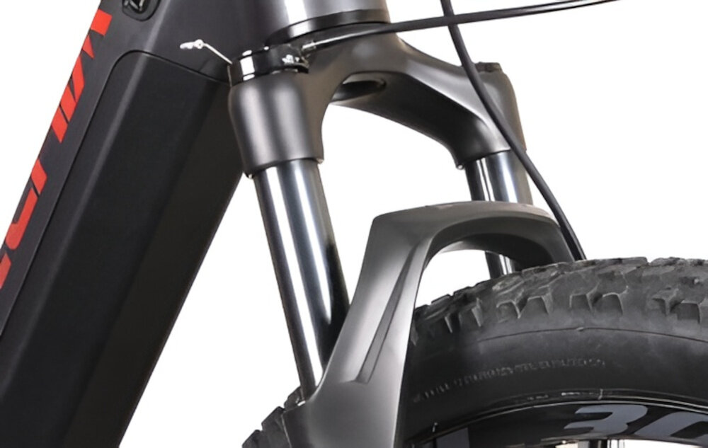 Rower elektryczny BOTTECCHIA Hydron M15 29 cali Antracytowy zbliżenie na amortyzator białe tło rower typu hardtail przedni amortyzator marki Rock Shox typu Judy TK Air RL ze skokiem 100 mm pracuje na sprężynie powietrznej regulację twardości jednym zaworem komory pozytywna i negatywna system tłumienia TurnKey rura sterowa typu stożkowego (TAPERED) sztywność prowadzenia
