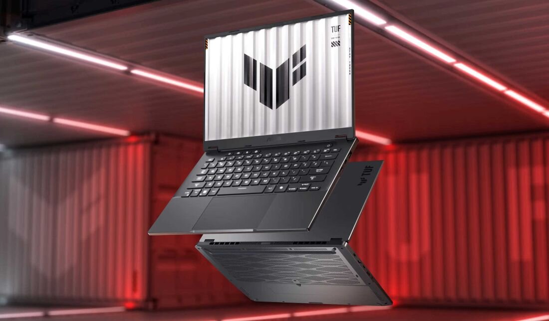 Otwarty laptop ASUS TUF Gaming A14 na czerowonym tle.