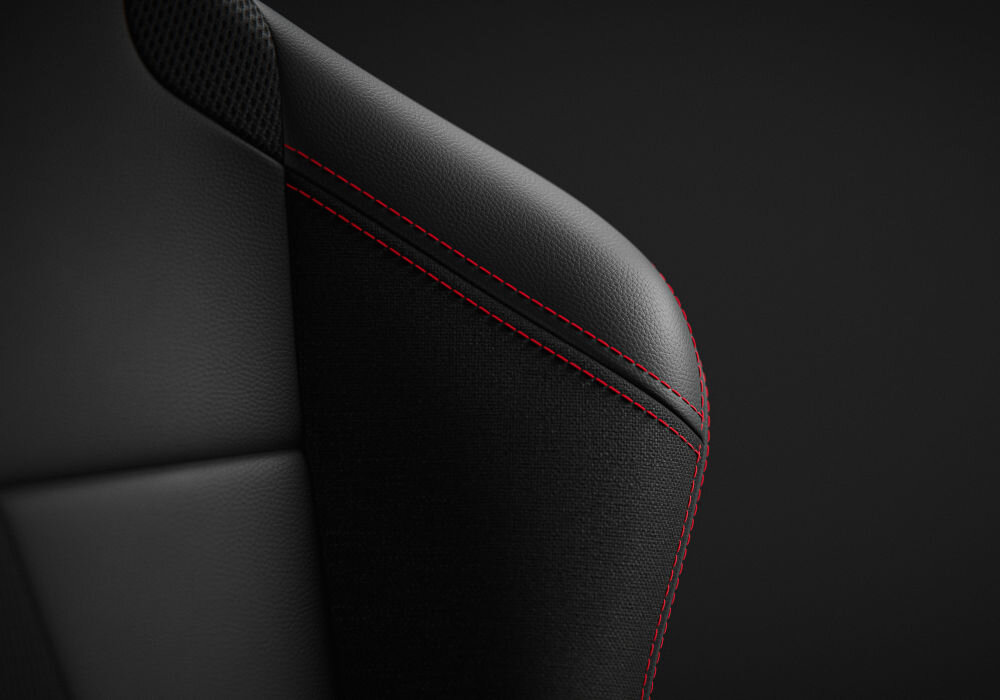 Kokpit DIABLO X-Drive Czarno-Biały zbliżenie na fotel na czarnym tle stworzony z 3 materiałów tkanina EcoFiber wytrzymała na przetarcia przewiewna siateczka wstawki z ekoskóry HDS