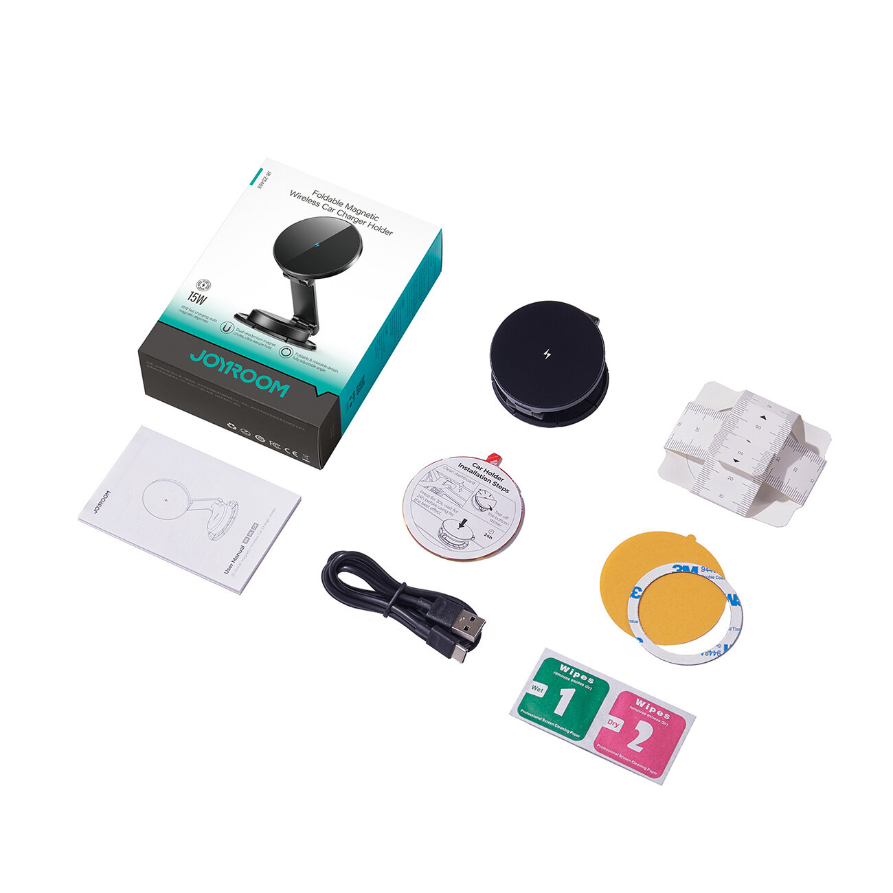 Na obrazie znajduje się zestaw akcesoriów do uchwytu samochodowego na telefon, w tym pudełko z napisem \'JOYROOM\', okrągła ładowarka, kabel USB, instrukcja oraz różne elementy montażowe. Widoczne są także dwie ściereczki oznaczone jako \'Wipe 1\' i \'Wipe 2\'.