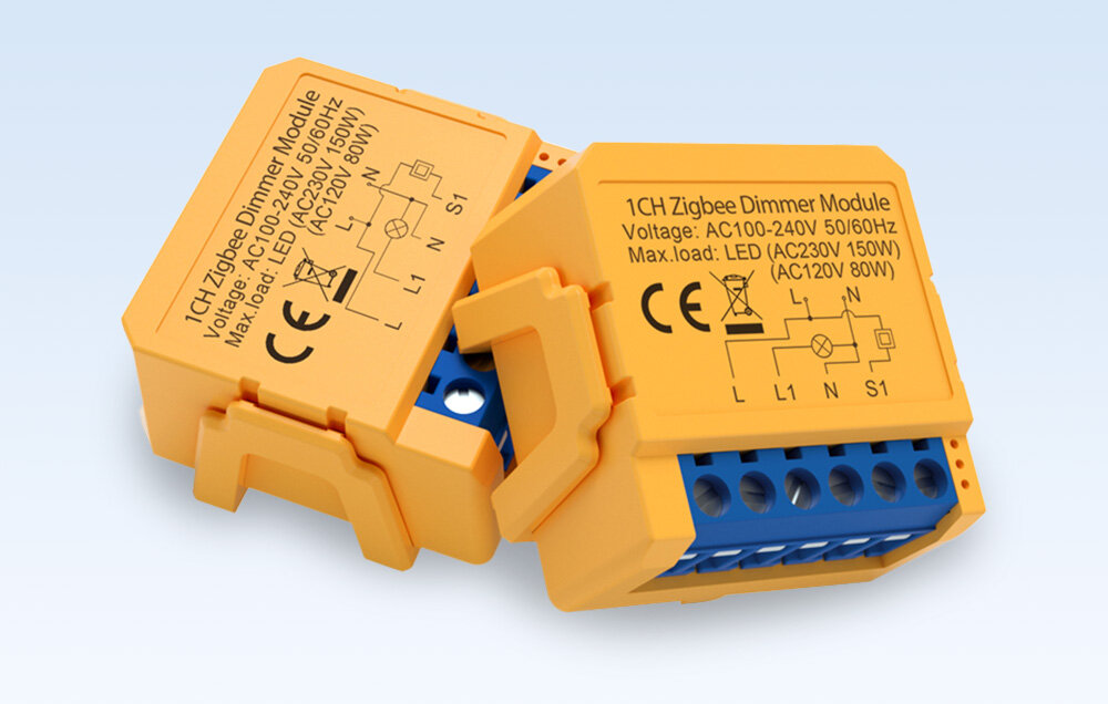 Dwa żółte moduły ściemniacza Zigbee z oznaczeniami technicznymi i schematem połączeń na obudowie. Widoczny tekst: \'1CH Zigbee Dimmer Module Voltage: AC100-240V 50/60Hz Max.load: LED (AC230V 150W) (AC120V 80W)\'.