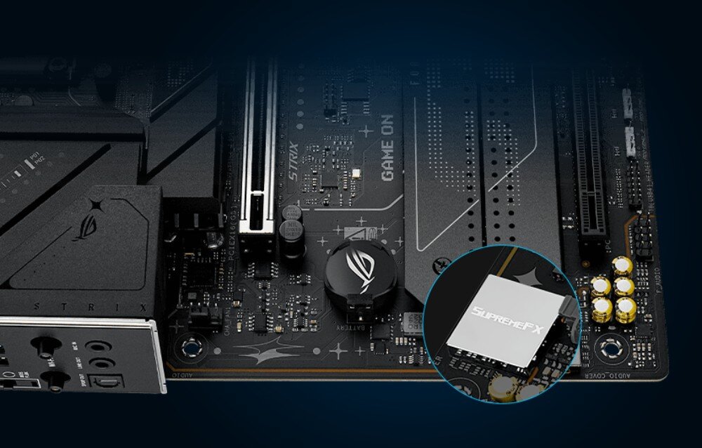 Płyta główna ASUS ROG STRIX B860-F Gaming WIFI Fragment dolnej części płyty głównej z wyróżnionym w okrągłym powiększeniu układem dźwiękowym SupremeFX