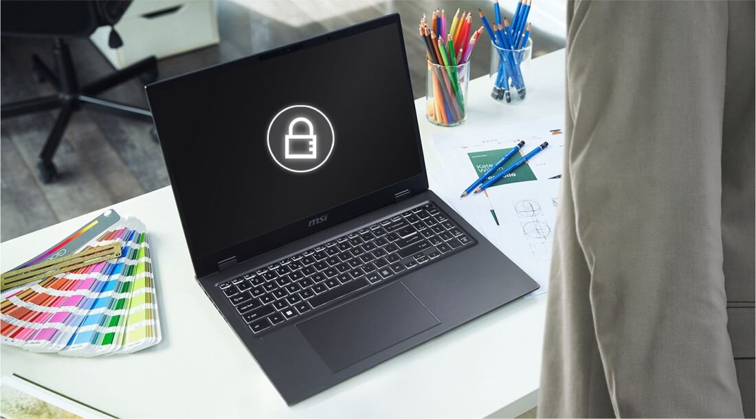 Użytkownik laptopa z widoczną ikoną kłódki, co wskazuje na ochronę prywatności i bezpieczeństwo informacji. - czujnik zbliżeniowy automatycznie aktywuje lub dezaktywuje ekran