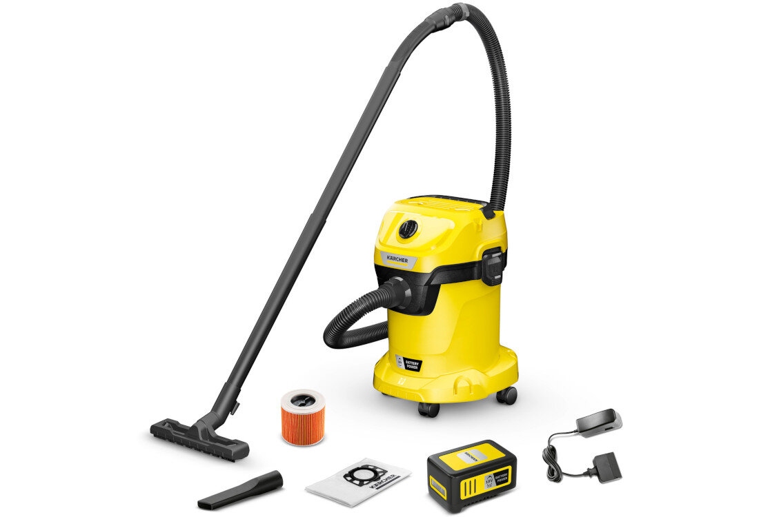 Na obrazie znajduje się żółty odkurzacz z czarnym wężem i różnymi akcesoriami, w tym filtr, bateria i ładowarka. Na odkurzaczu widoczne jest logo \'KARCHER\'.