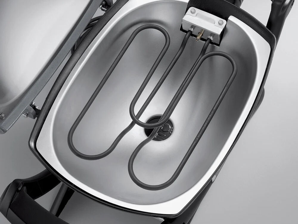 Grill elektryczny WEBER Q 1400 52020879 ze stojakiem, moc grzałki, czyszczenie, prostota, wygoda, Zbliżenie na spiralną grzałkę elektryczną wewnątrz misy grilla Weber Q 1400