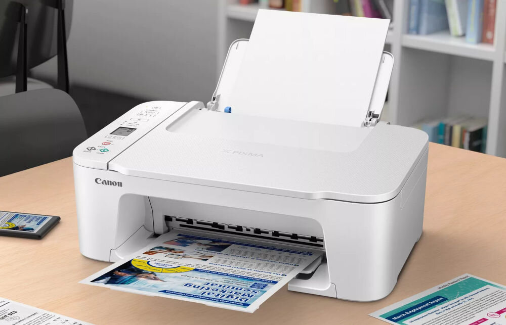 Urządzenie wielofunkcyjne CANON Pixma TS3751i Druk w kolorze, Wi-Fi  prezentacja urządzenia na biurku w biurze wśród dokumentów