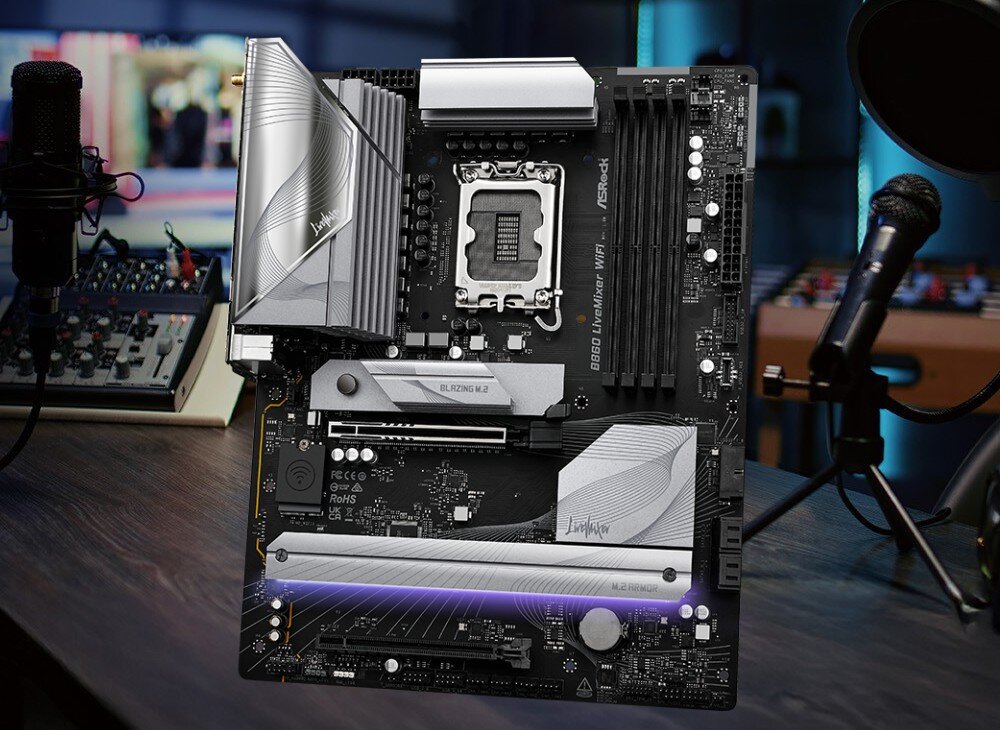 Płyta główna ASROCK B860 LiveMixer WiFi Płyta główna wyeksponowana na biurku pomiędzy dwoma mikrofonami studyjnymi
