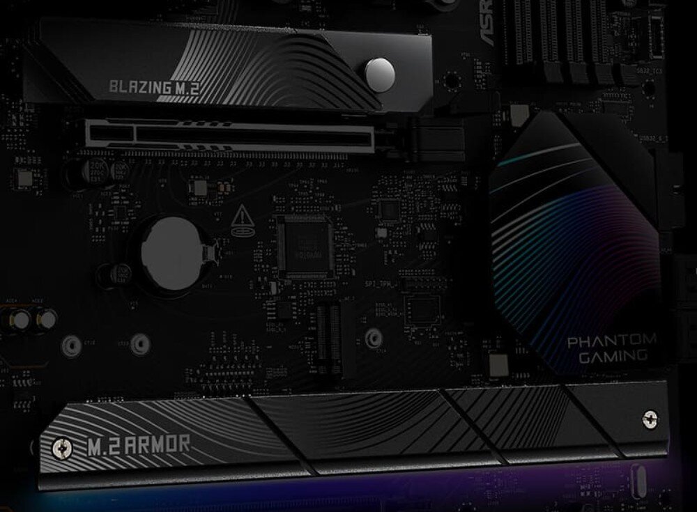 Płyta główna ASROCK B850 RIPTIDE WIFI Detal środkowej części płyty głównej pokazujący radiatory osłaniające dyski M.2. Górny element posiada napis 'Blazing M.2', a dolny, większy radiator oznaczono napisem 'M.2 Armor'. Powierzchnie metalowych osłon zdobią wzory falistych linii