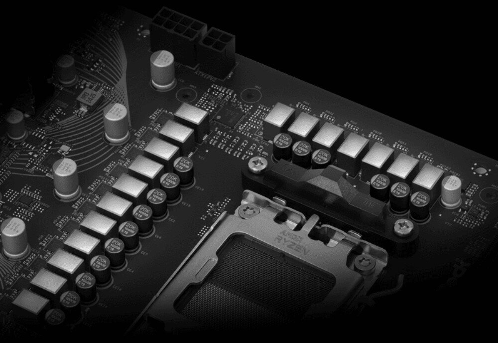 Płyta główna ASROCK B850 LiveMixer WiFi Fragment sekcji zasilania płyty głównej z rzędami kondensatorów i elementami obok gniazda procesora, układ zasilania, kondensatory