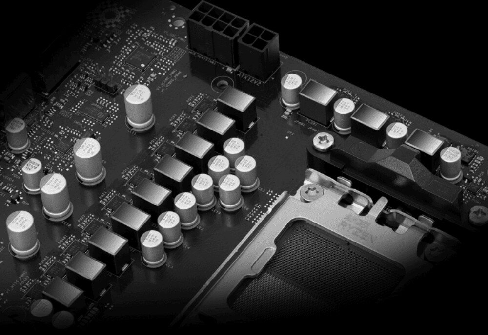 Płyta główna ASROCK B850M Pro RS Zbliżenie na sekcję zasilania procesora ukazujące rzędy metalowych dławików i kondensatorów na ciemnym laminacie