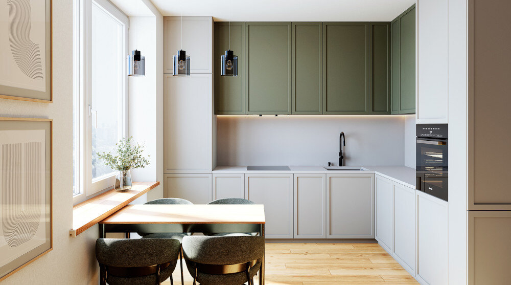 OKAP GLOBALO FLUXIME Obraz pokazuje całą kuchnię w układzie litery „L”, z zielonymi frontami górnych szafek i jasnymi dolnymi. Po lewej stronie znajduje się jadalniany stół przy oknie, a po prawej zabudowany piekarnik i zmywarka cicha praca kuchnia turbina zewnętrzna redukcja hałasu 67 dB dźwięk komfort gotowania