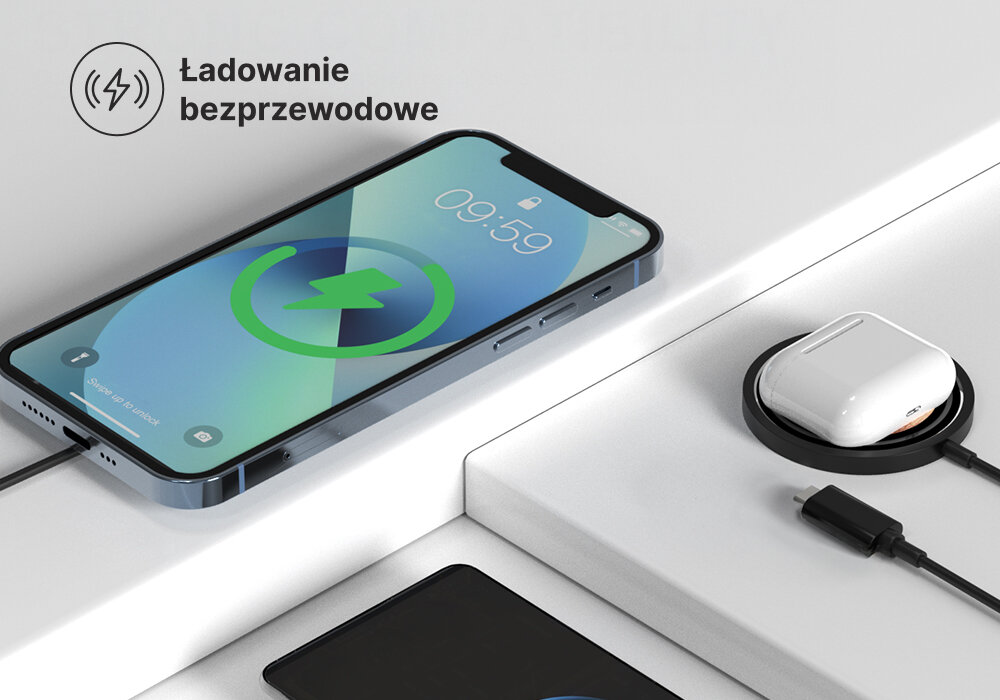 Ładowarka indukcyjna QUALO Transparent QTLI-15-01 Czarny, Magnetyczne połączenie, Indukcja podpięta pod smartfona, obok na blacie komplet słuchawek, kabli