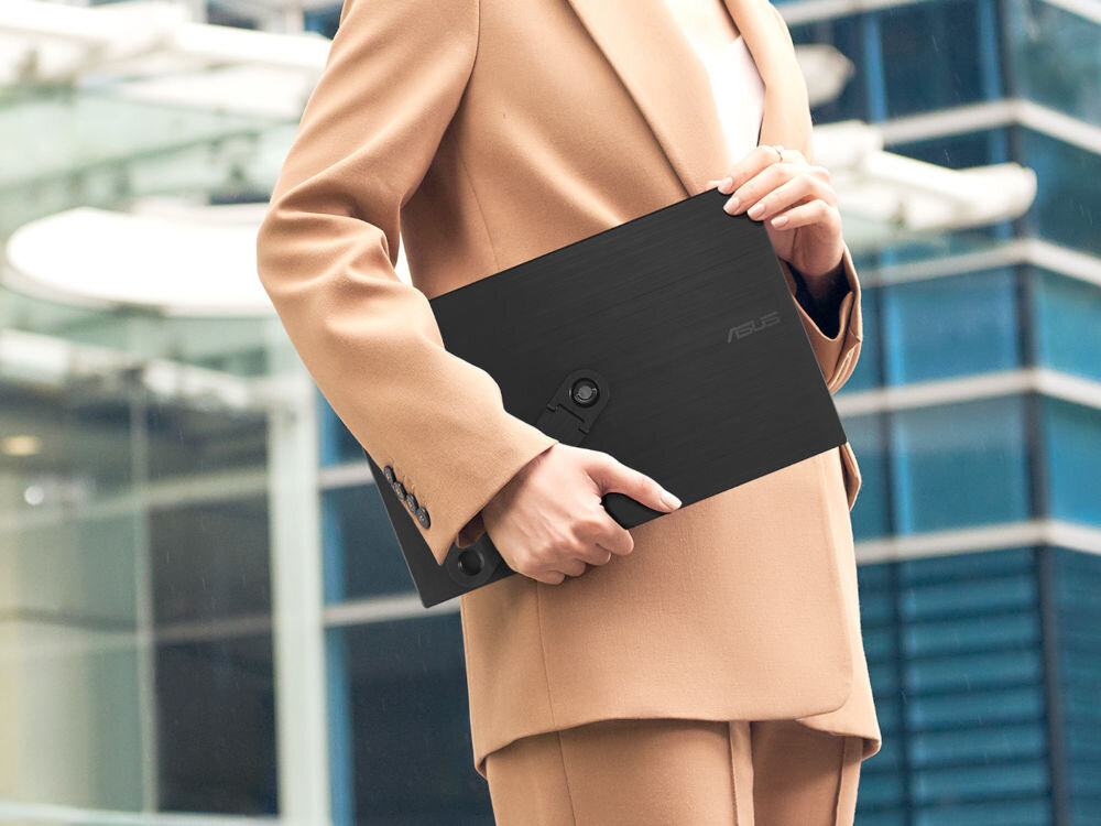 Monitor ASUS ZenScreen MB169CK 15.6 1920x1080px IPS 5 ms [GTG] trzymany pod pachą przez osobę w garniturze