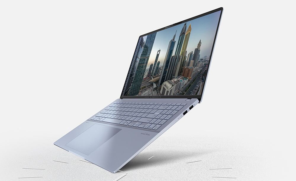 Laptop ASUS Vivobook S 16 OLED - Laptop z widokiem na panoramę miasta na ekranie. bateria o pojemności 75 Wh, Technologia szybkiego ładowania