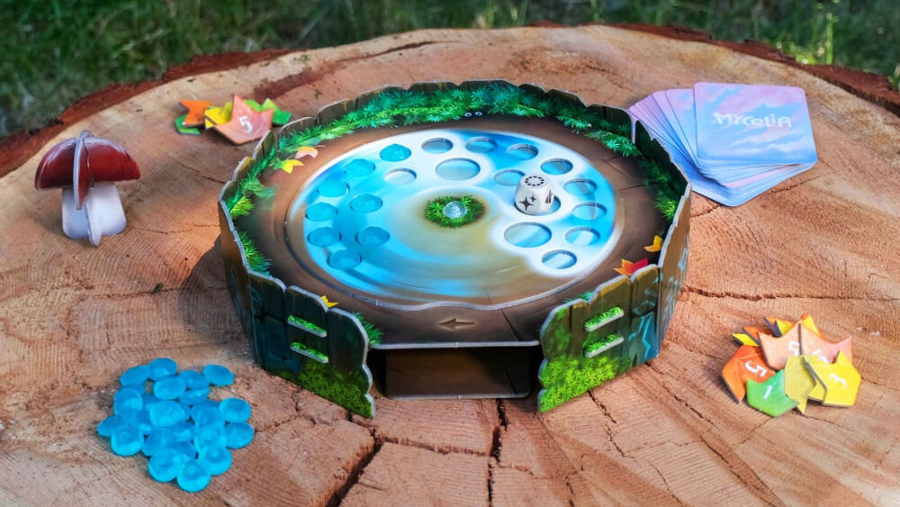 Gra planszowa RAVENSBURGER Mycelia 22898 rozpakowana gra na pienku ulepszanie talii oczyszczanie planszy z krople wody wygrana zwycięstwo w grze