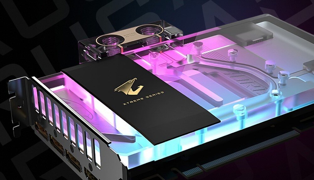 Karta graficzna GIGABYTE Aorus GeForce RTX 5080 Xtreme WaterForce WB 16GB Karta graficzna w futurystycznym otoczeniu z efektami świetlnymi. Wyróżnia się przeźroczystym chłodzeniem cieczą z widocznymi śrubami mocującymi i złoconymi detalami
