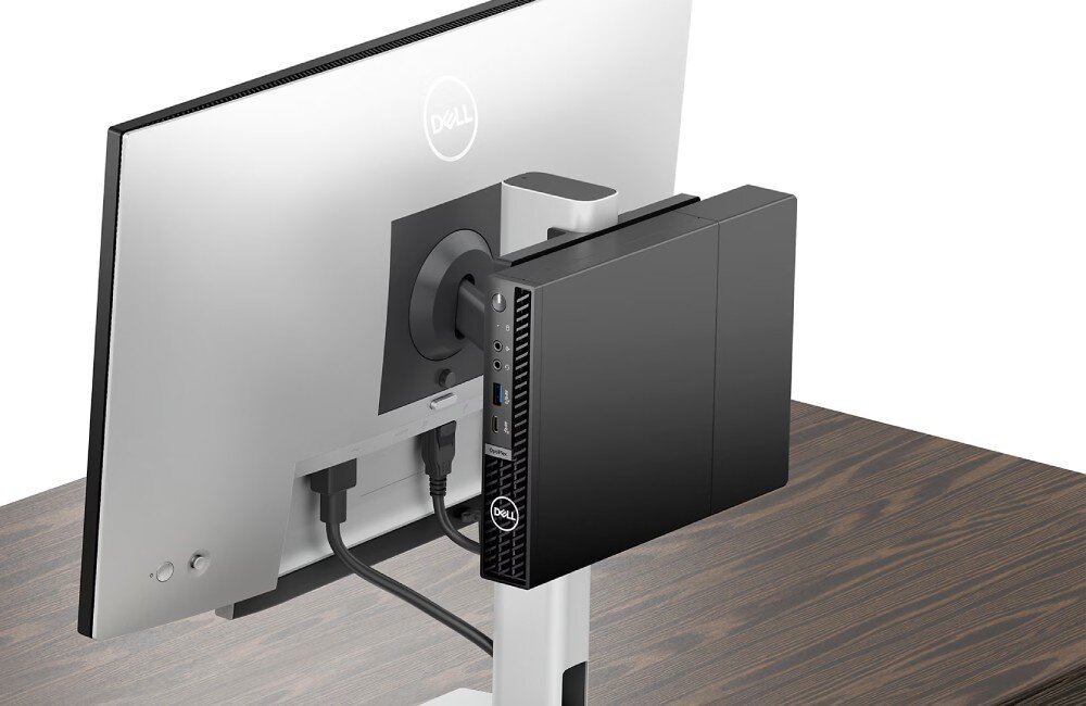 Komputer DELL Optiplex 7020 MFF Plus Zbliżenie na tył monitora z przymocowanym do niego małym komputerem, przeznaczenie, wielkość, wymiary, montaż