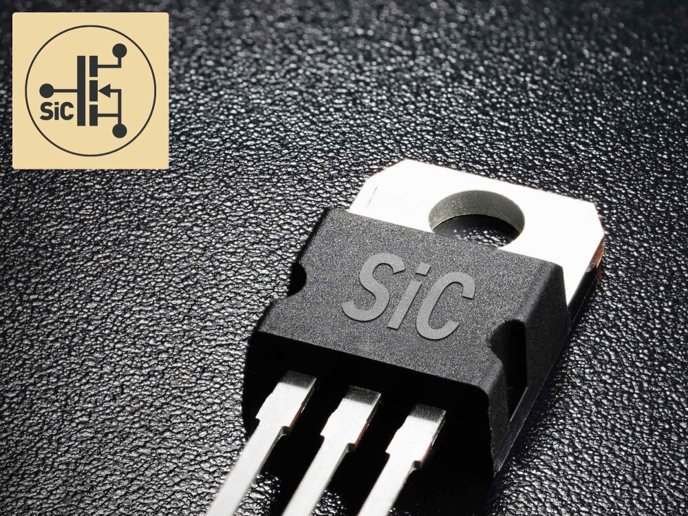 Zasilacz MSI MEG Ai1600T Makrofotografia tranzystora z oznaczeniem SiC i metalowymi nóżkami na ciemnym teksturowanym tle