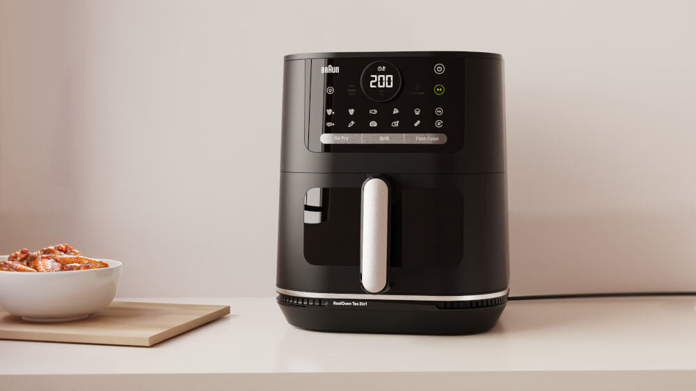 Air Fryer Frytkownica beztłuszczowa BRAUN MultiFry 5 HF5073 frytkownica stoi na blacie czarna obudowa panel wyświetlacz przyciski uchwyt z 20 automatycznymi programami gotowania zdrowie smukła sylwetka potrawy z minimalną ilością tłuszczu do 90% mniej tłuszczu zróżnicowana dieta sprzęt BRAUN smak jakość