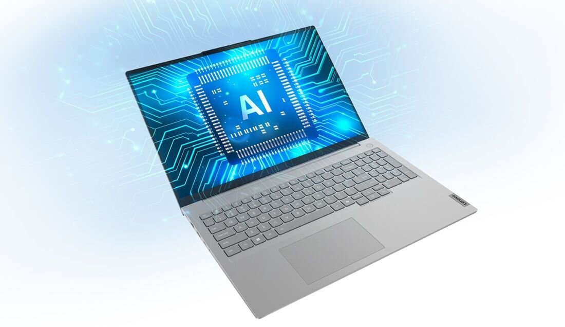 Laptop Lenovo ThinkBook 16 w srebrnej obudowie z ekranem prezentującym procesor z napisem AI na niebieskiej płycie głównej z dynamicznymi połączeniami świetlnymi i efektami elektronicznymi, wizualizacja zaawansowanej technologii sztucznej inteligencji. - Intel Core, Intel Graphics