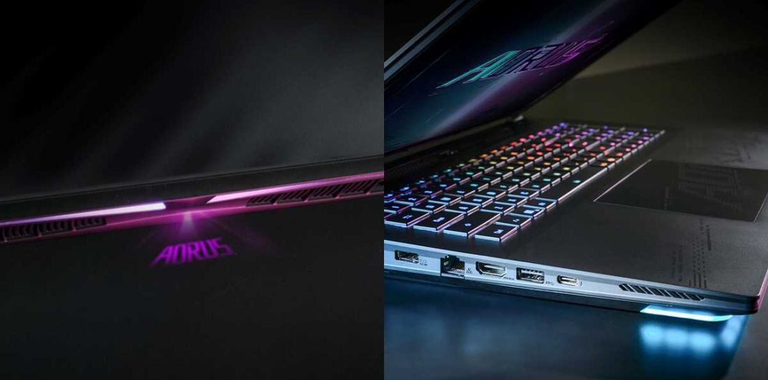 Laptop GIGABYTE Aorus Master 18 - Laptop GIGABYTE Aorus Master 18 z fioletowym światłem, które wydobywa się z wnętrza, nadając mu unikalny wygląd.
