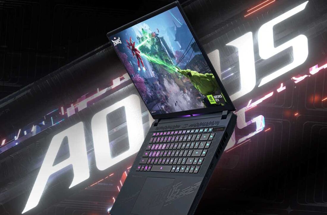 Laptop GIGABYTE Aorus Master 16 - Gamingowy laptop GIGABYTE Aorus Master 16, ukazujący elegancki wygląd i zaawansowane możliwości na tle napisu Aorus.