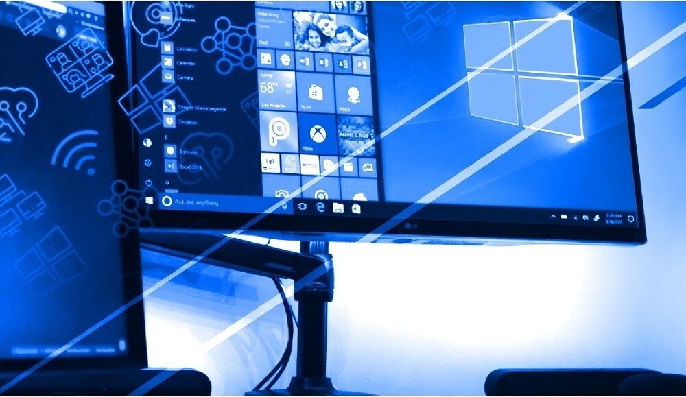 Komputer NTT proDesk ZKO-I712H610-L05HV2 Dwa monitory komputerowe na biurku z widocznym systemem operacyjnym i ikonami, nałożone graficznie na niebieskie tło z symbolami technologicznymi, przeznaczenie, zastosowanie