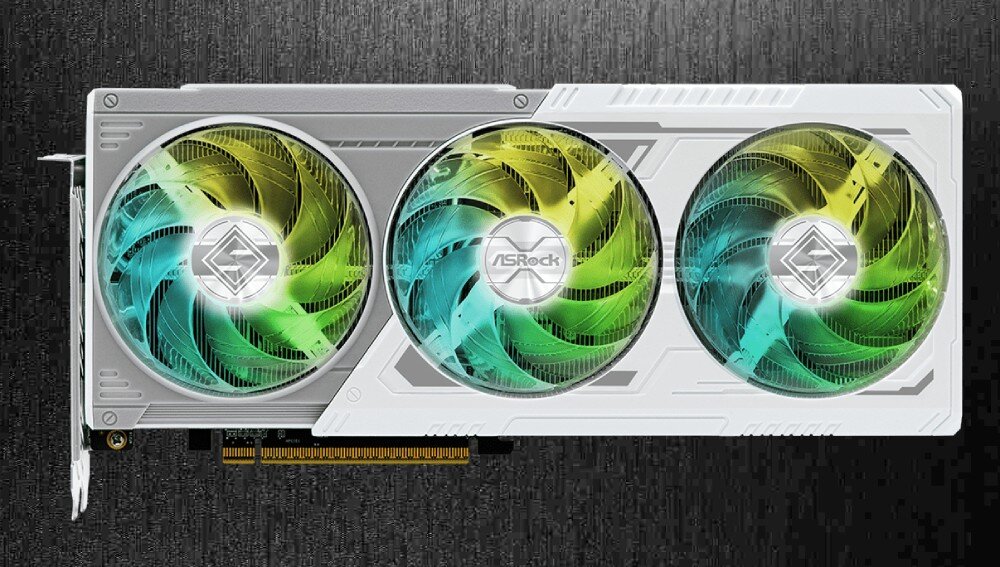 Karta graficzna ASROCK Radeon RX 9070 Steel Legend OC 16GB Widok od frontu na kartę graficzną z trzema wentylatorami z kolorowym podświetleniem. Karta ma białą obudowę o geometrycznych kształtach, wentylatory, chłodzenie, wentylacja