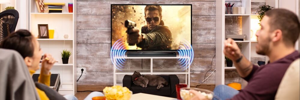 Soundbar JVC TH-E534B, pilot zdalnego sterowania, kabel HDMI, uchwyt ścienny, baterie w zestawie, soudbar stojący na stoliku pod telewizorem