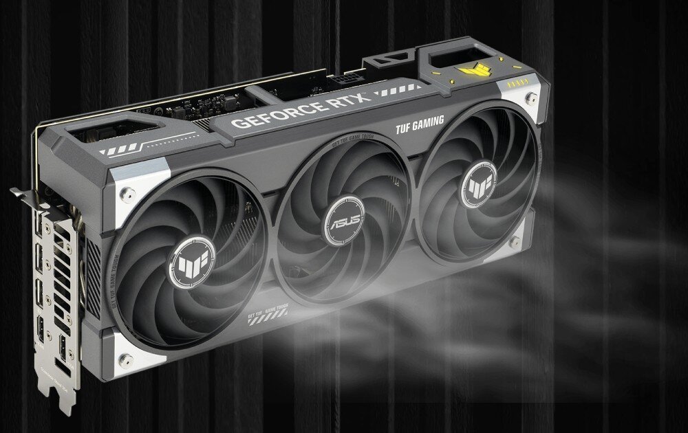 Karta graficzna ASUS TUF Gaming GeForce RTX 5070 Ti GDDR7 16GB Model karty na ciemnym tle z wizualnym efektem chłodzenia, symbolizującym przepływ powietrza przez wentylatory. Efekt podkreśla działanie układu chłodzenia Axial-tech, chłodzenie, wentylatory, łożyska, temperatura