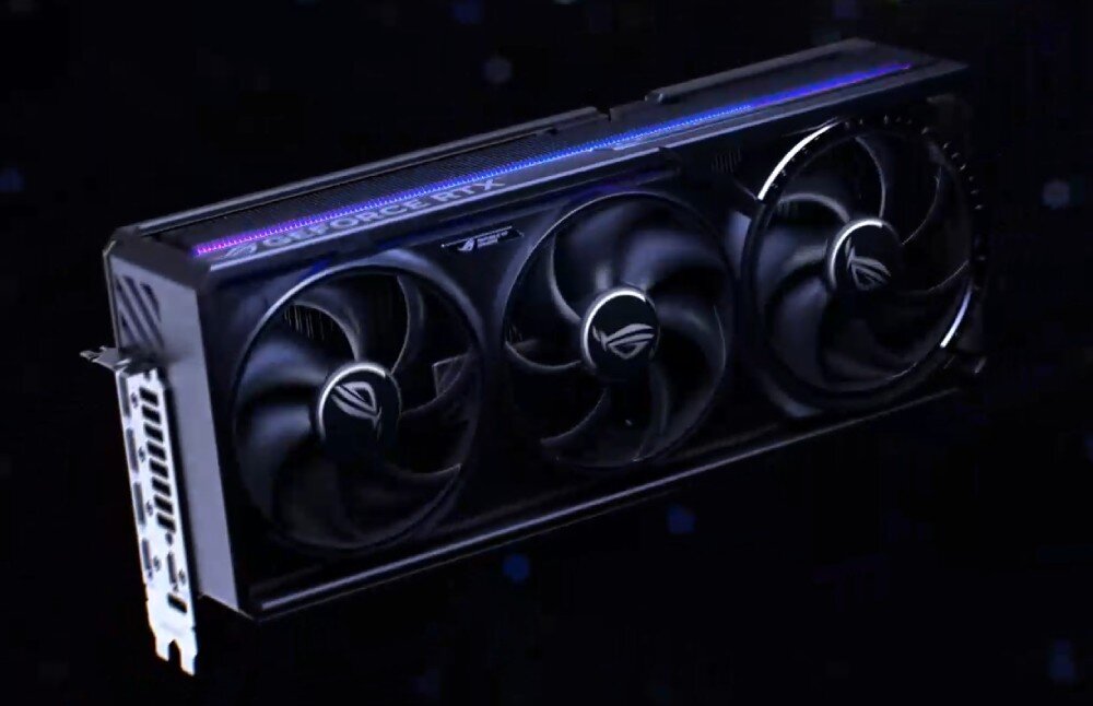 Karta graficzna ASUS GeForce RTX 5080 ROG Astral OC 16GB Karta graficzna ASUS ROG Astral OC w ciemnym otoczeniu, podświetlona niebiesko-fioletową linią LED na górnej krawędzi