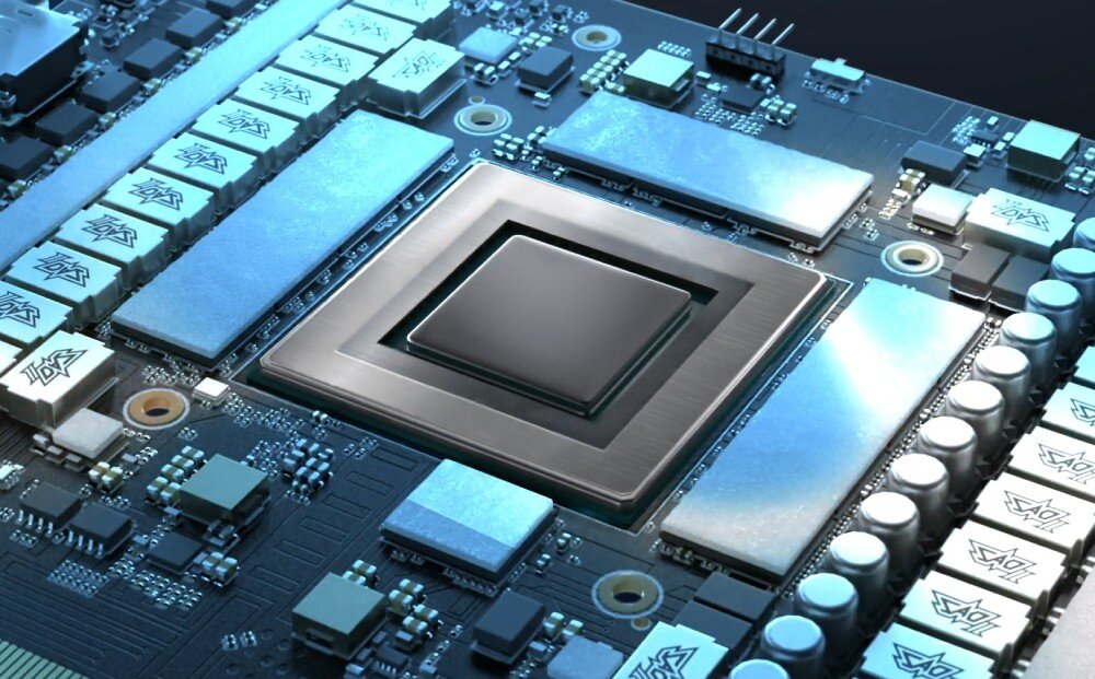 Karta graficzna ASUS GeForce RTX 5090 TUF Gaming 32GB Obraz przedstawiający procesor graficzny na płycie PCB, otoczony komponentami sekcji zasilania. Układ scalony jest umieszczony centralnie, odbijając światło