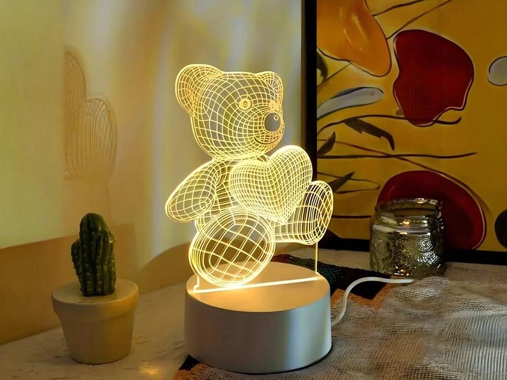 Lampka nocna EXTRALINK Miś serce 3D USB, światło, 3D, serca, noc, Świetlista lampka nocna 3D z misiem, sercami, kwiatami obok ramek z obrazkami.