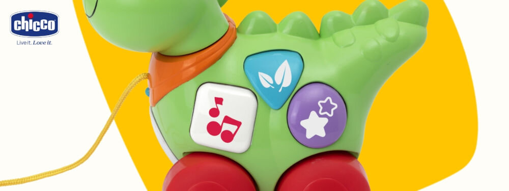 Zabawka interaktywna CHICCO Baby Sense & Focus Mój pierwszy Dino 00012119000000 zielona obudowa zbliżenie na przyciski z ilustracjami biało żółte tło trzy interaktywne przyciski różne dźwięki i melodie naciśnięcie przycisku rozwijanie zdolności słuchowych różnorodne dźwięki rozpoznawanie różnych tonów i rymów rozwój muzykalności i percepcji słuchowej