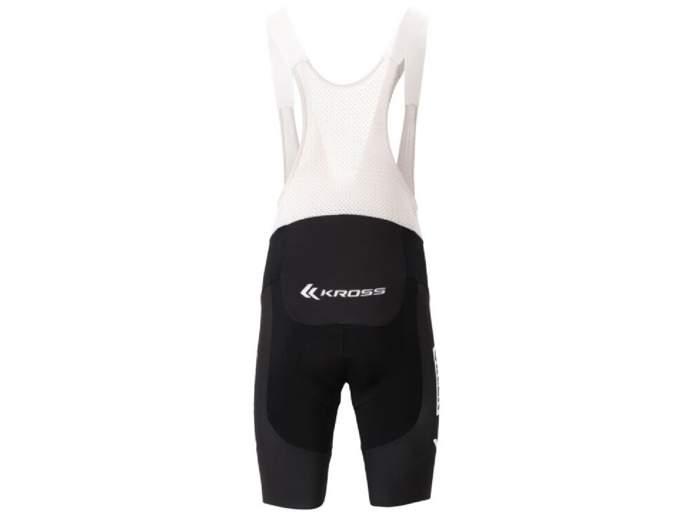 Spodenki rowerowe KROSS Orlen Cycling Team Replika (rozmiar M) Czarno-biały spodenki na białym tle widoczne od tyłu do intensywnej jazdy szosowej gravelowej MTB precyzyjny krój elastyczne szelki wygoda ochrona efektywność jazdy w sezonie letnim w rozmiarze M dla osób o wzroście 174-178 cm