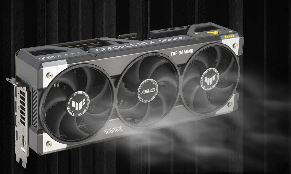 Karta graficzna ASUS TUF Gaming GeForce RTX 5080 16GB OC Edition Model karty na ciemnym tle z wizualnym efektem chłodzenia, symbolizującym przepływ powietrza przez wentylatory. Efekt podkreśla działanie układu chłodzenia Axial-tech, chłodzenie, wentylatory, łożyska, temperatura