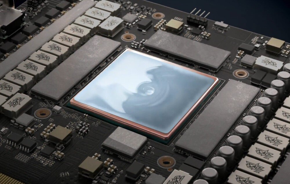 Karta graficzna ASUS TUF Gaming GeForce RTX 5080 16GB OC Edition Zbliżenie na układ chłodzenia ASUS ROG Astral, ukazujące procesor graficzny pokryty pastą termoprzewodzącą, powierzchnia radiatora, podkładka termoprzewodząca