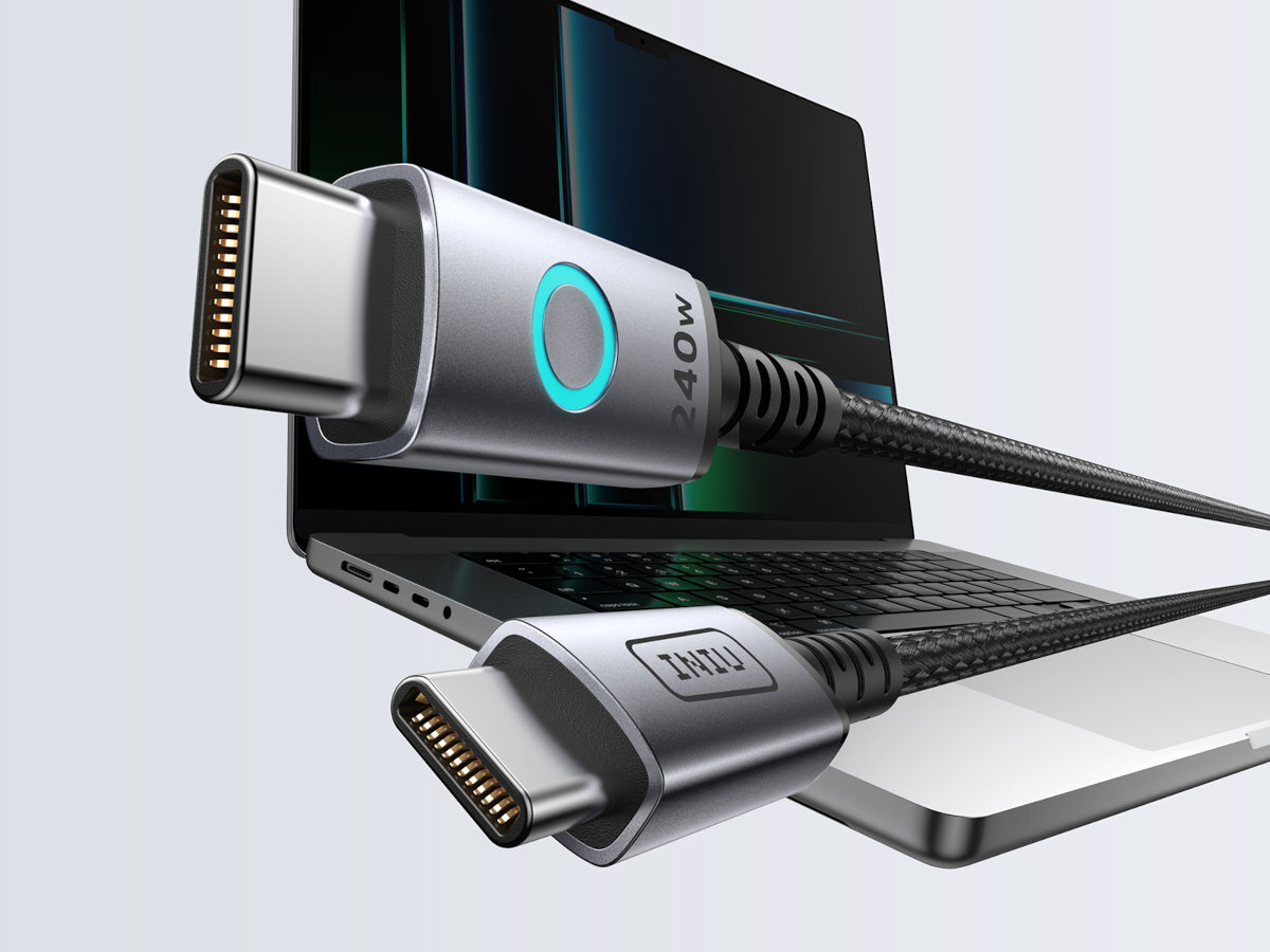 INIU Leopard Magnetic 240W szybkiego ładowania iPhone 16 71% naładowania w 30 minut chroniąc telefon przed przegrzaniem magnetycznemu złączu - wtyczki kabla usb-c w tle laptop