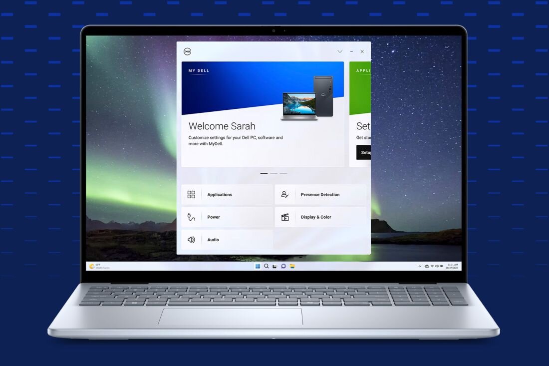 Laptop Dell Inspiron 5640 z ekranem prezentującym aplikację MyDell, srebrna klawiatura, cienkie ramki ekranu, tło z jasnymi, pionowymi liniami. - MyDell