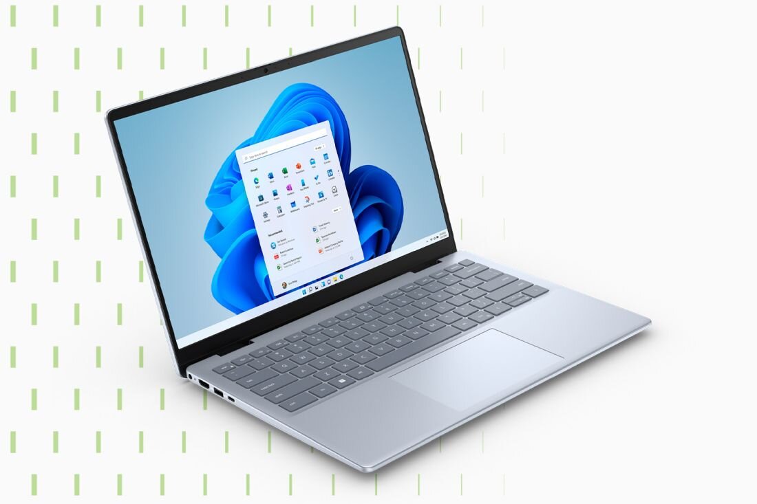 Laptop Dell Inspiron Plus 7440 z wyświetlaczem prezentującym pulpit systemu Windows 11 Pro, srebrna klawiatura, cienkie ramki ekranu, jasne tło z zielonymi liniami. - Windows 11