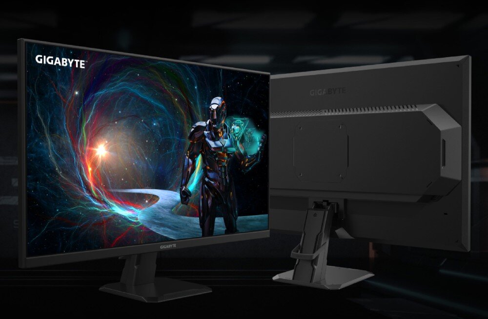 Monitor GIGABYTE GS27FA Widok monitora od frontu i od tyłu. Na ekranie postać humanoidalnego robota w kosmicznym tle z wirującą energią. Tył monitora pokazuje możliwość montażu VESA, porty, wyjścia, przekątna, montaż VESA