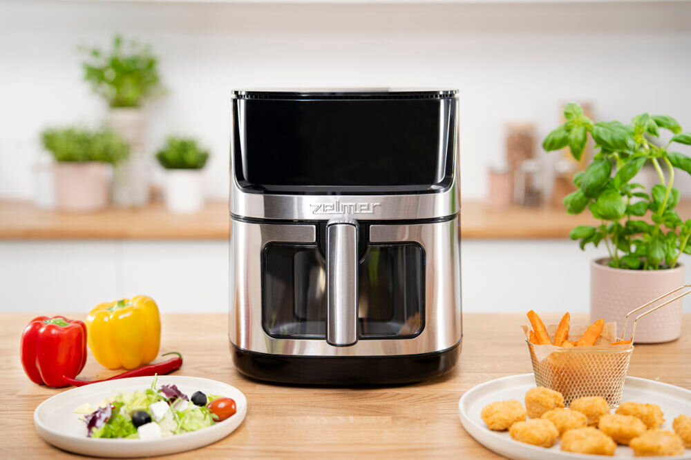 Air Fryer Frytkownica beztłuszczowa ZELMER ZAF8650 chrupiące dania frytkownica stoi na blacie srebrno czarna posiłki wokół urządzenia chrupiące dania